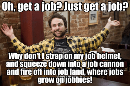 Charlie Day, wearing a yellow and black checkered shirt, holds up his hands as if to say: "Oh, get a job? Just get a job?"